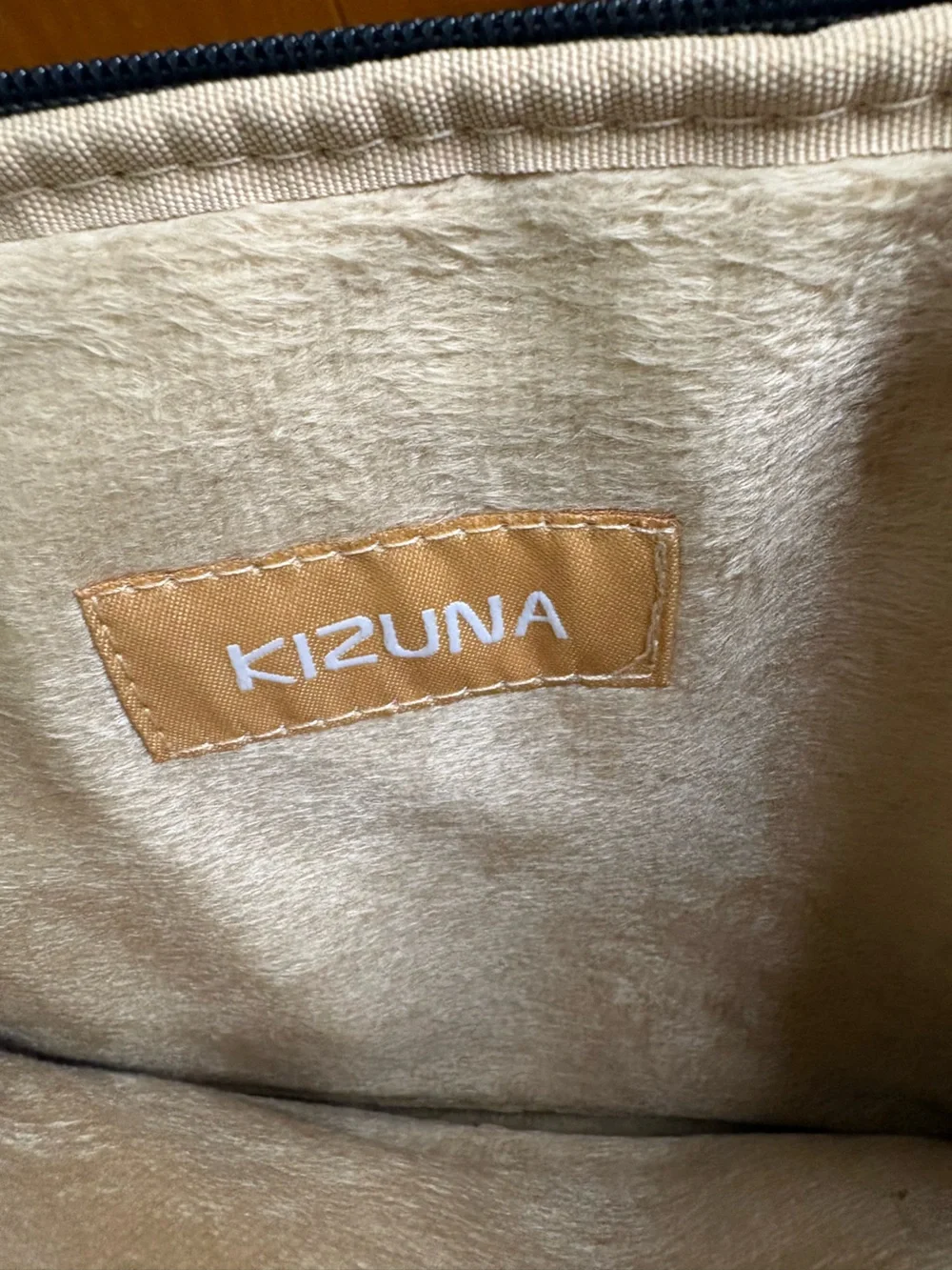Kizuna water-resistant gray fabric laptop sleeve features a soft interior lining